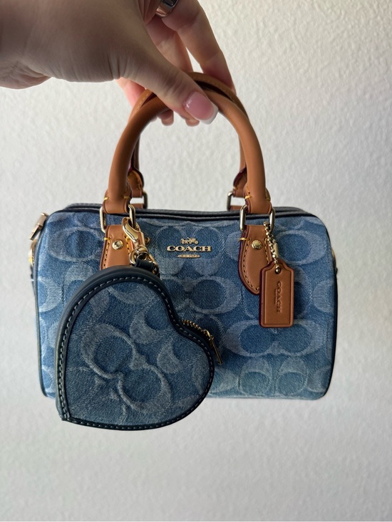 Coach Handbags - COACH mini Rowan in signature denim WITH heart charm.